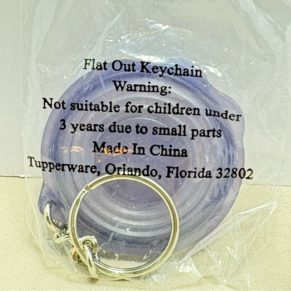 Tupperware Flat Out Keychain. Collectible and rare. Vintage